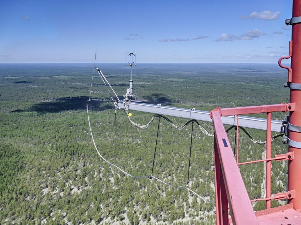 gigantic view into the distance from the top of the Tall tower with 3-D-anemometer and gas inlet to the horizon