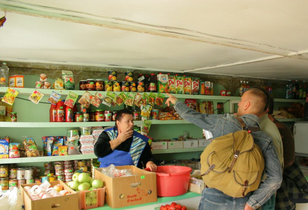 Travelers shopping in small siberian kiosk